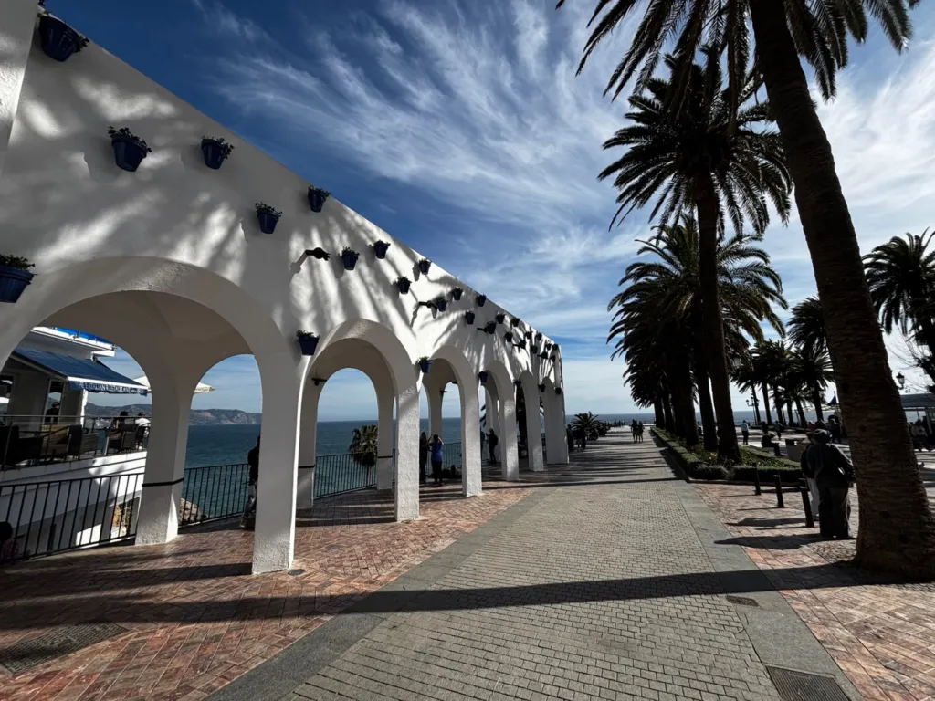 Whitewashed arches along the Balcón de Europa promenade