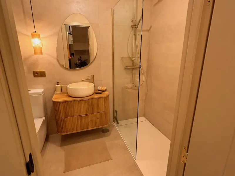Bathroom with shower and wooden vanity