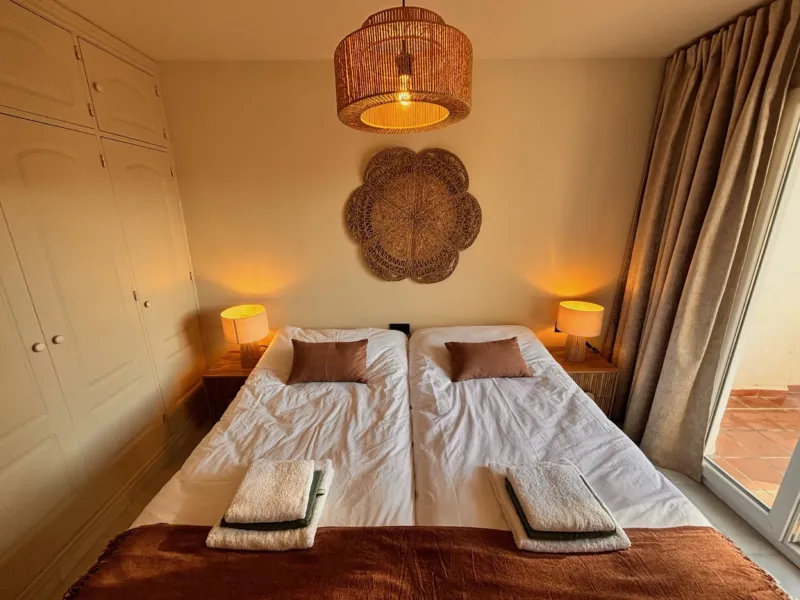 Bedroom 1 with the rattan rosette above the bed