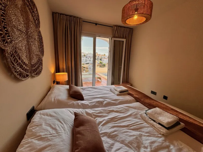 Bedroom 3 with French doors to the terrace