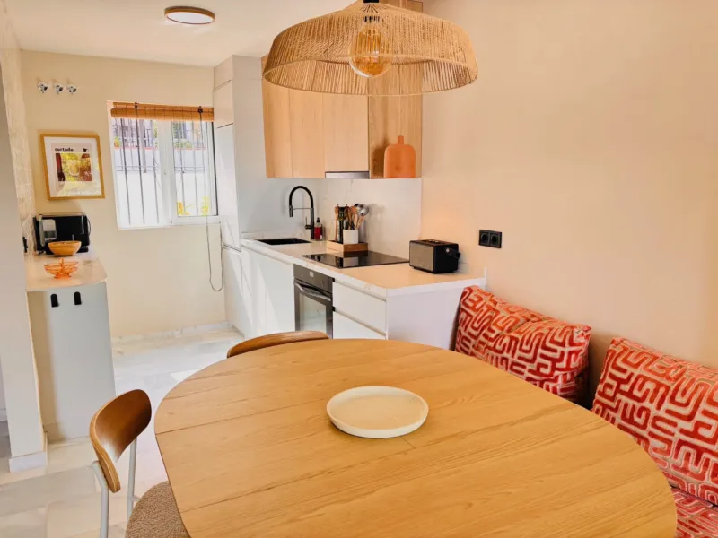 Dining corner with a bench and patterned cushions
