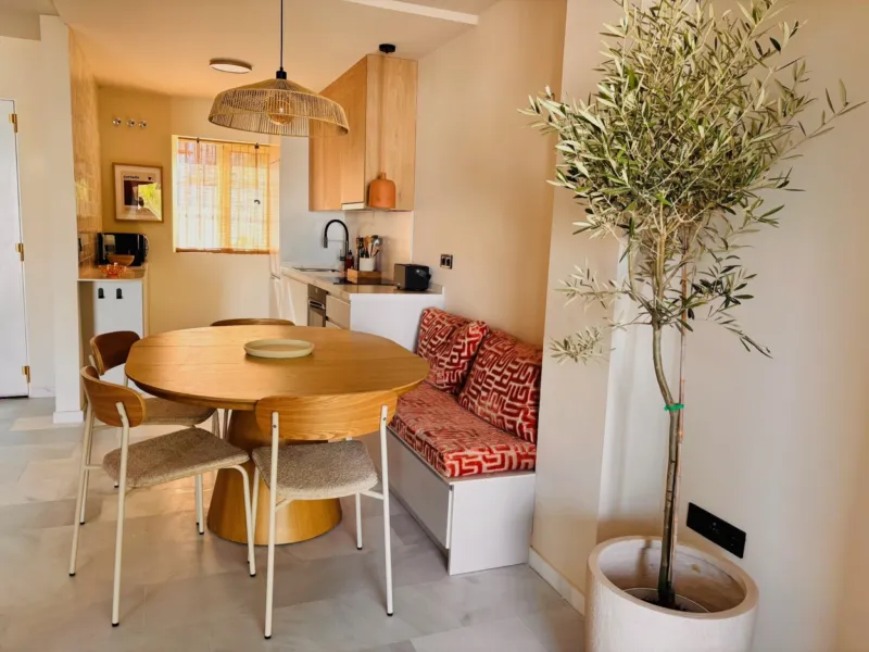 Dining table with an olive tree