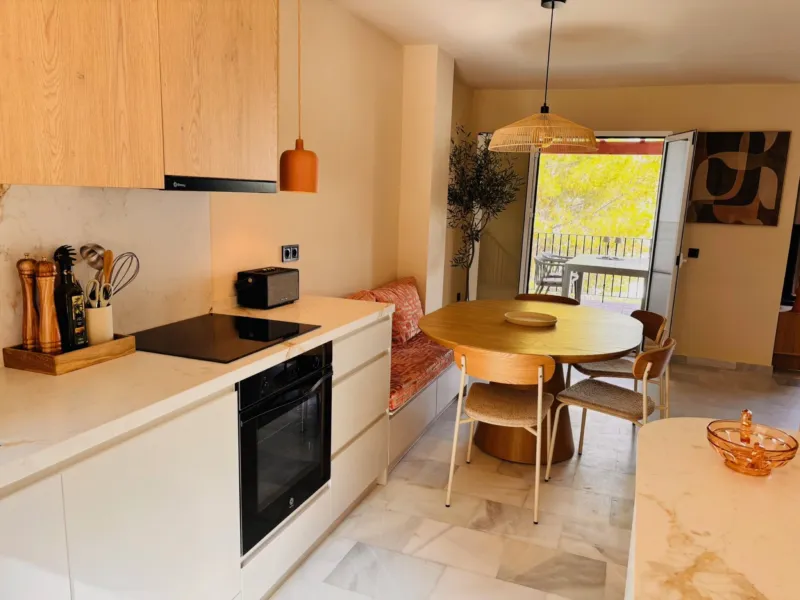 Kitchen with oven and dining table