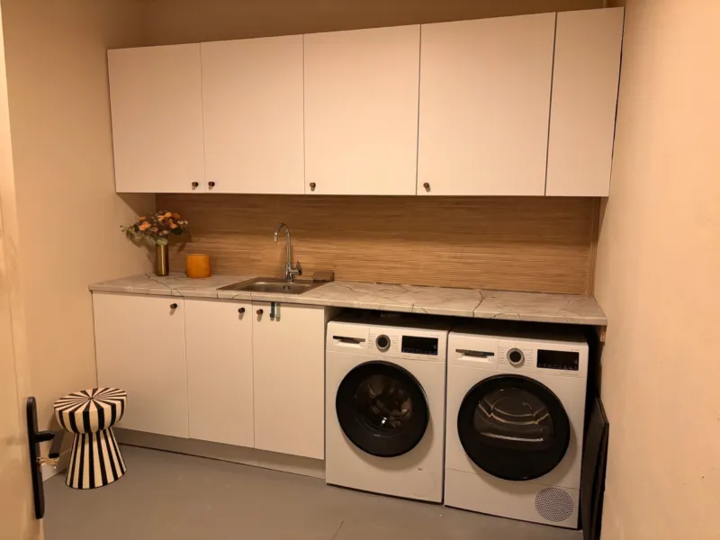 Laundry room with washing machine and dryer