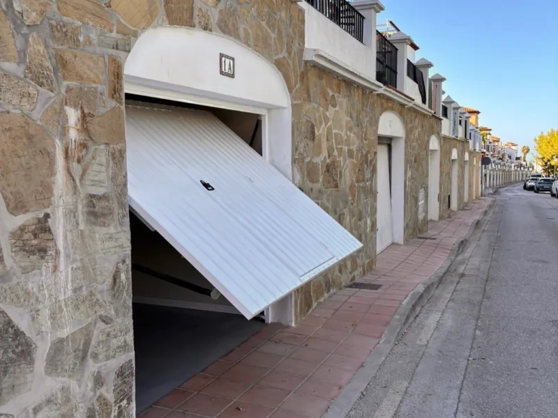 Open garage door on the street