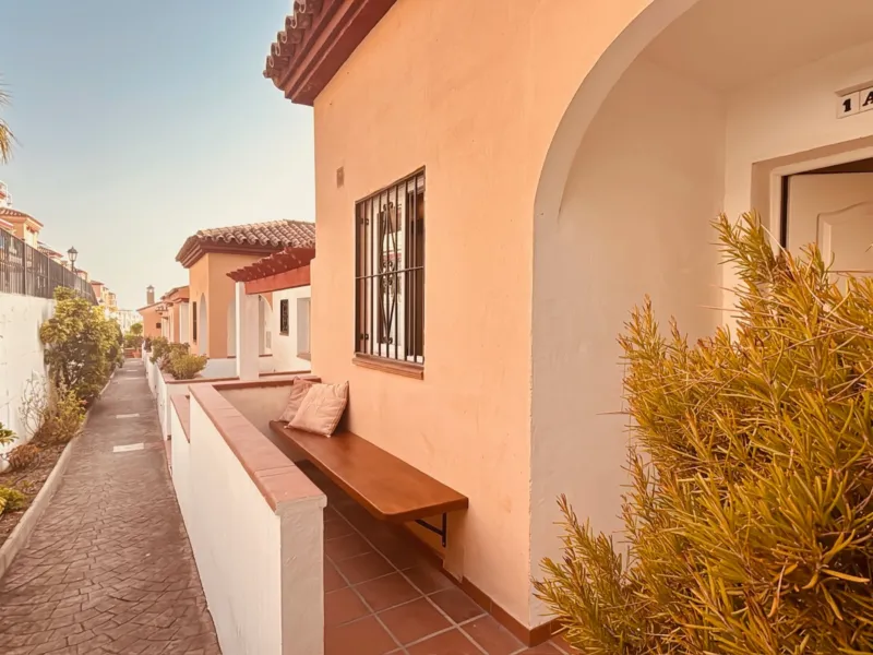 Path to the entrance along whitewashed walls
