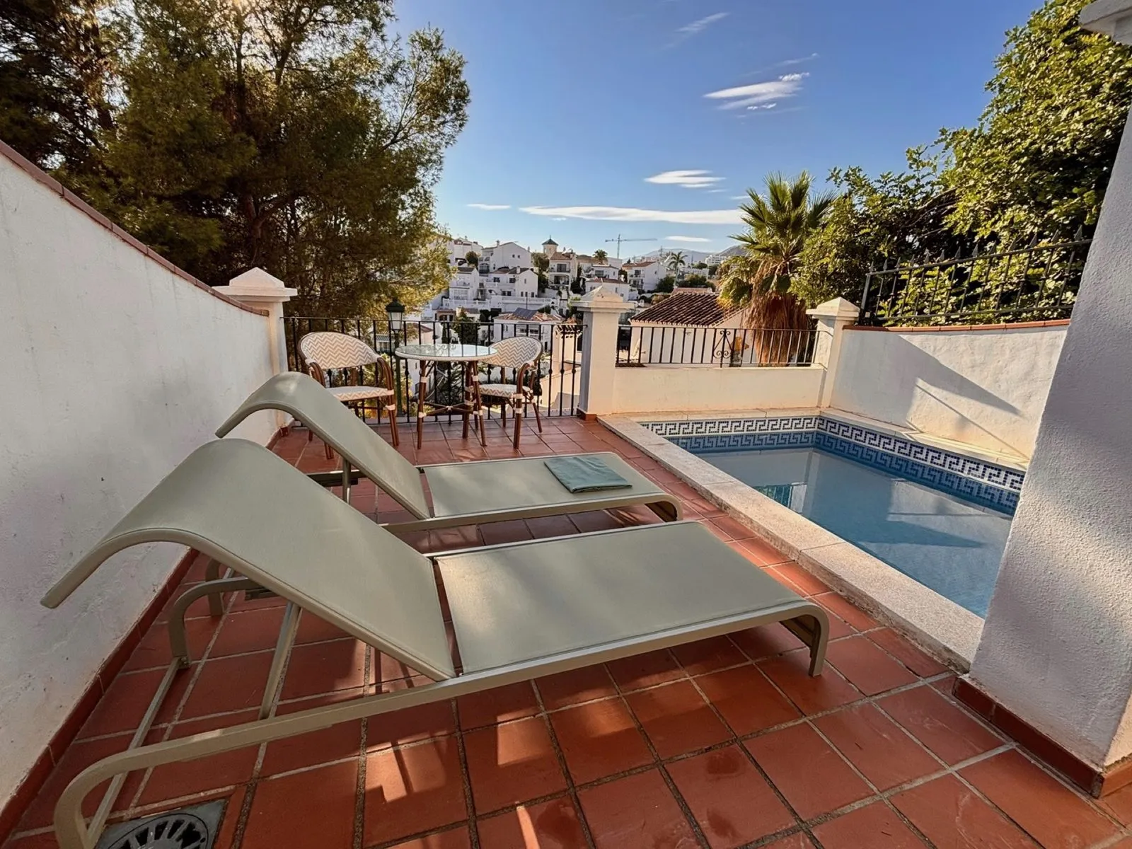 Sun loungers by the heated private pool, with a view over Nerja