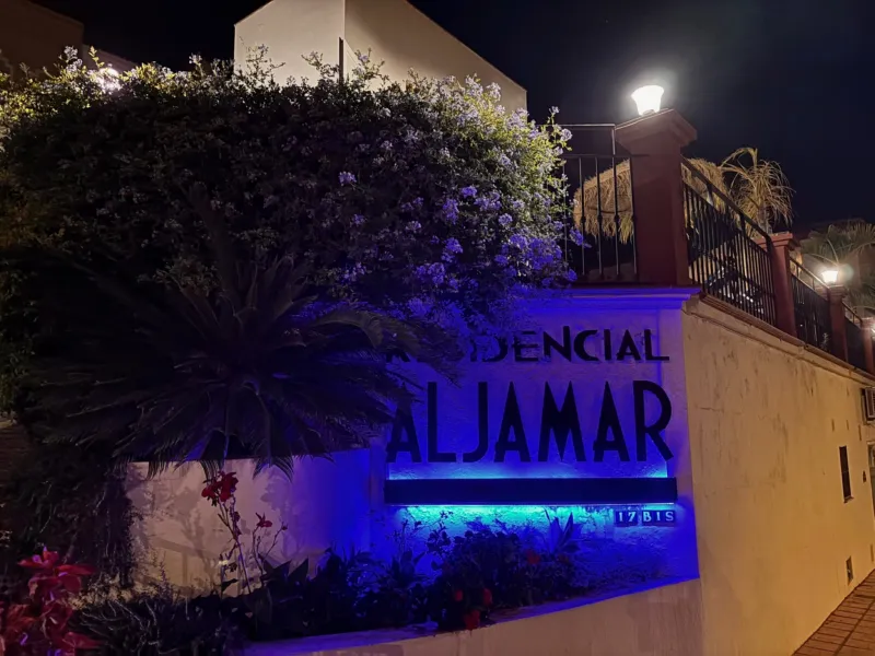 Residencial Aljamar entrance at night
