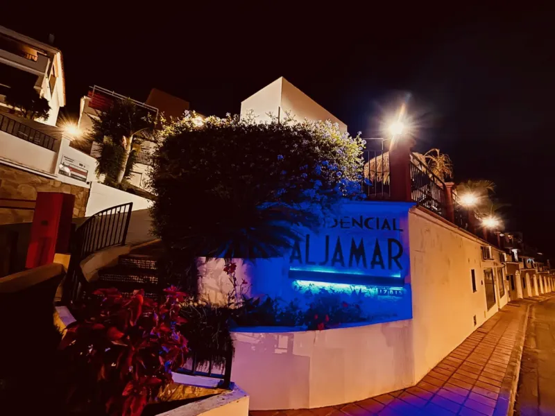 Residencial Aljamar sign at night