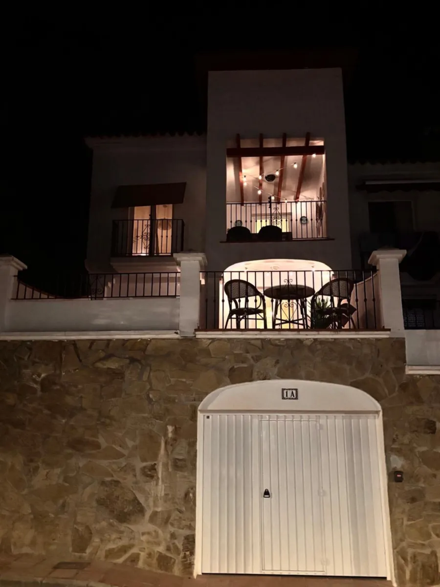 The house at night with lit windows