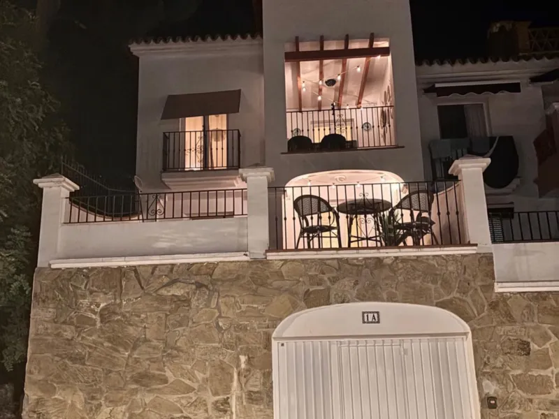 The house lit up at night