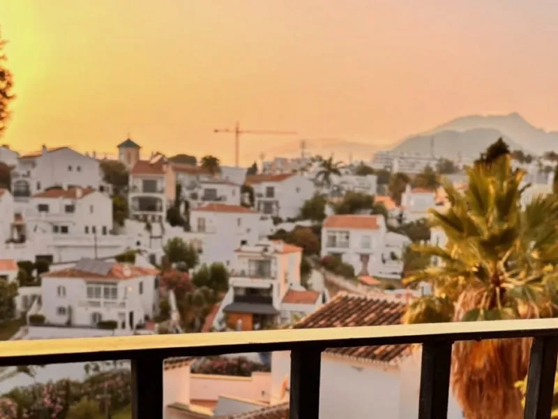 Sunset over Nerja and the mountains, seen from the balcony