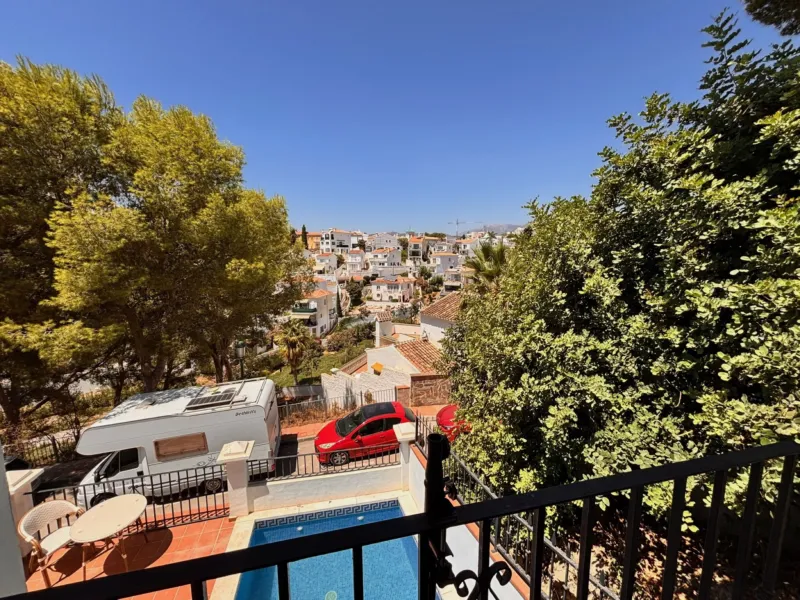 View over the pool and the residence