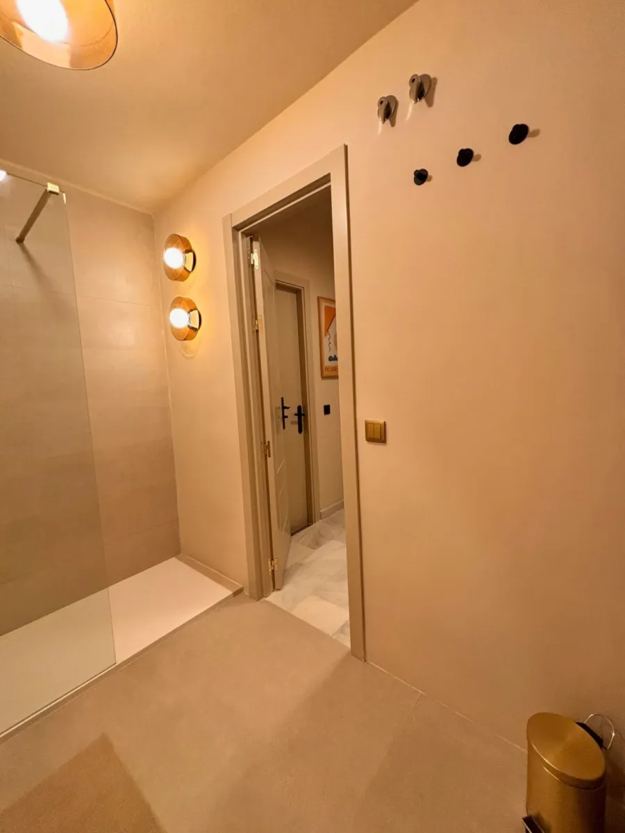 Walk-in shower with brass fittings